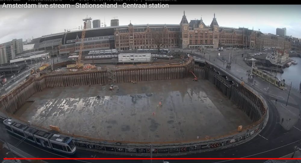 Large hole being dug in front of Amsterdam Centraal station from the construction webcam