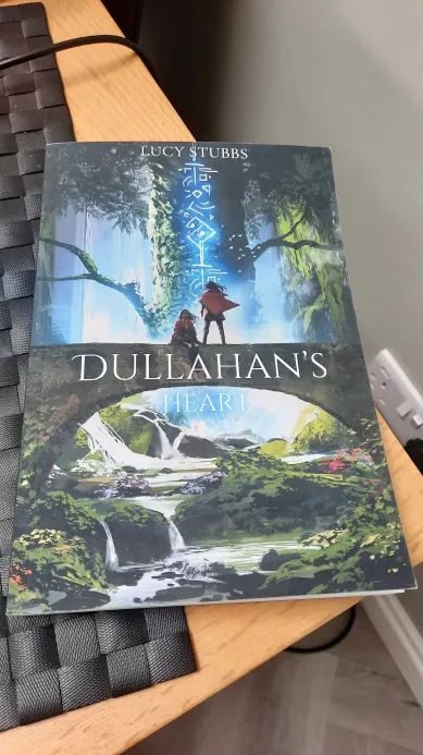 A book sits on a table named Dullahan's Heart written by Lucy Stubbs
