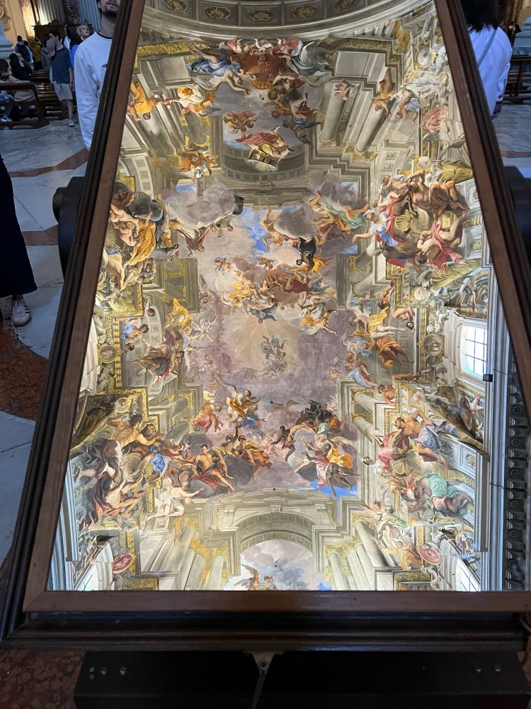 Mirror reflection of the ceiling of Chiesa San Ignazio Loyola