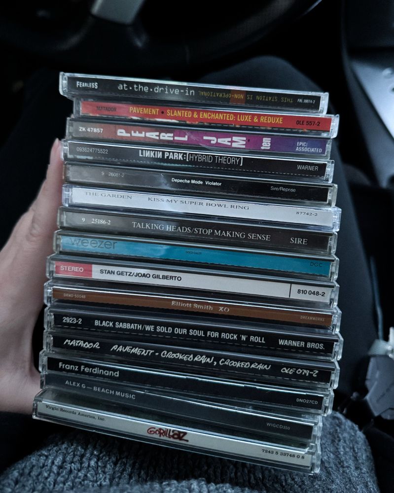 A small pile of cds, mostly alternative and indie musicians.