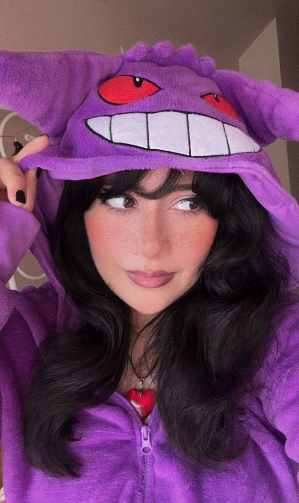 A photo of the user wearing a Gengar onesie 