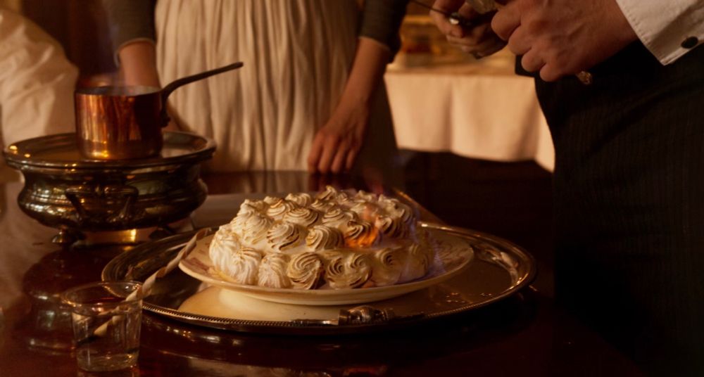 Still from The Taste of Things (2023) Dir. Tran Anh Hung. Pictured is a flambé dessert.