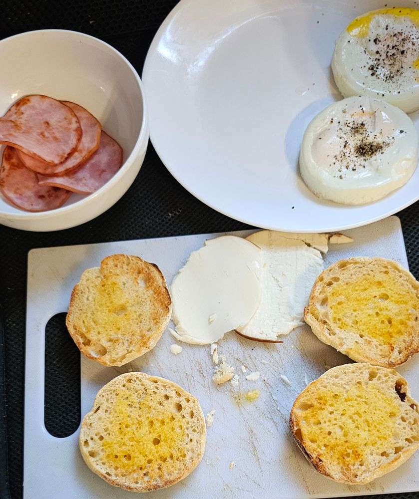 Cooked Canadian bacon, toasted English muffins with butter, smoked goat gouda cheese, two homemade egg mcmuffin patties.