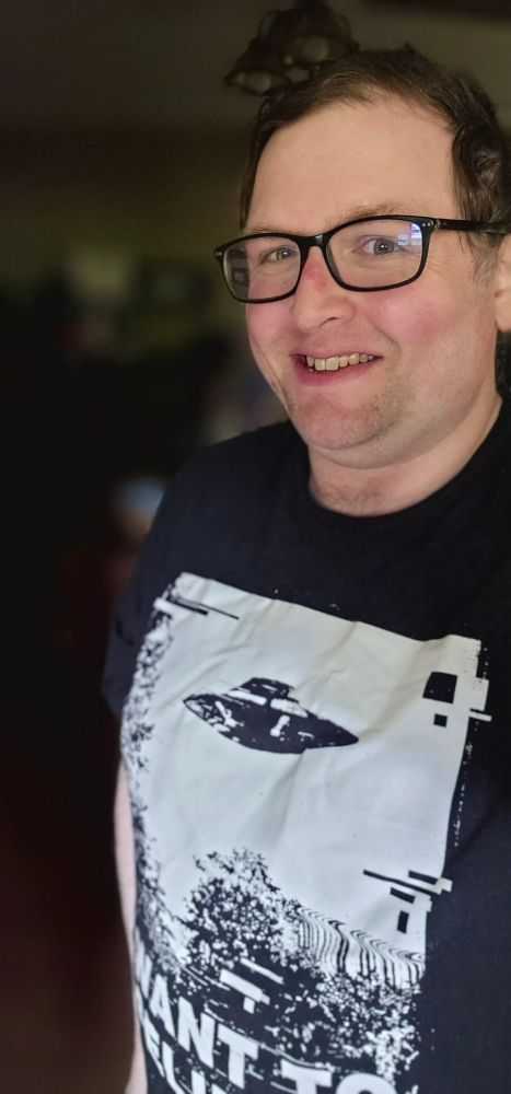 Me wearing a t-shirt with the "I want to believe" poster from the X Files on it.