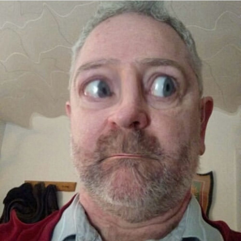 A digitally manipulated selfie with eyes magnified to enormous size, looking off to the side in apparent apprehension.