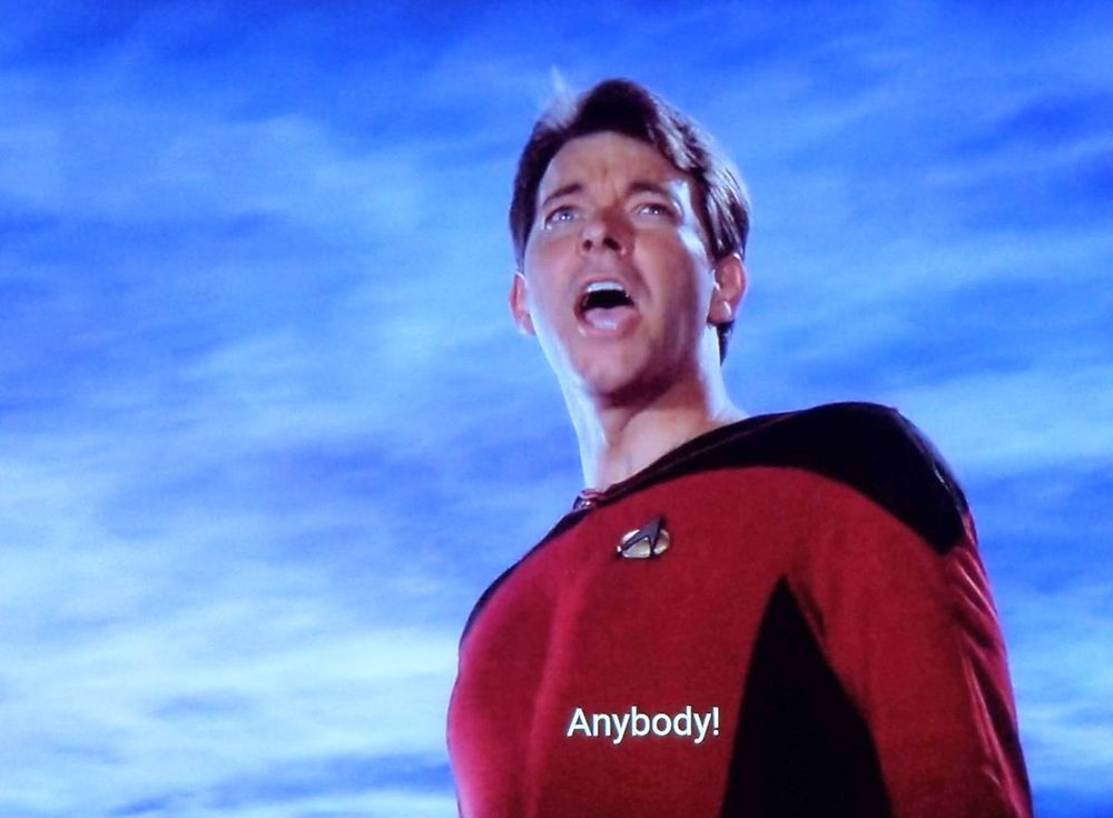 Star Trek The Next Generation’s Commander Riker (beardless) yelling with the caption “Anybody?”