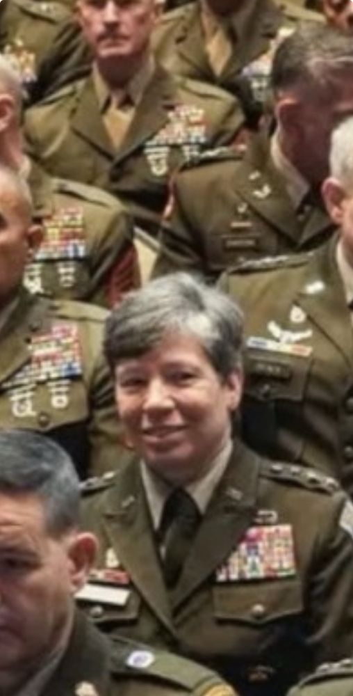 Closeup of a high ranking military person in the audience at the Quantico sh*t show today. Appears to be looking directly at the canera, smiling faintly. I don’t know if it was taken while FOTUS was speaking or that other guy. 
