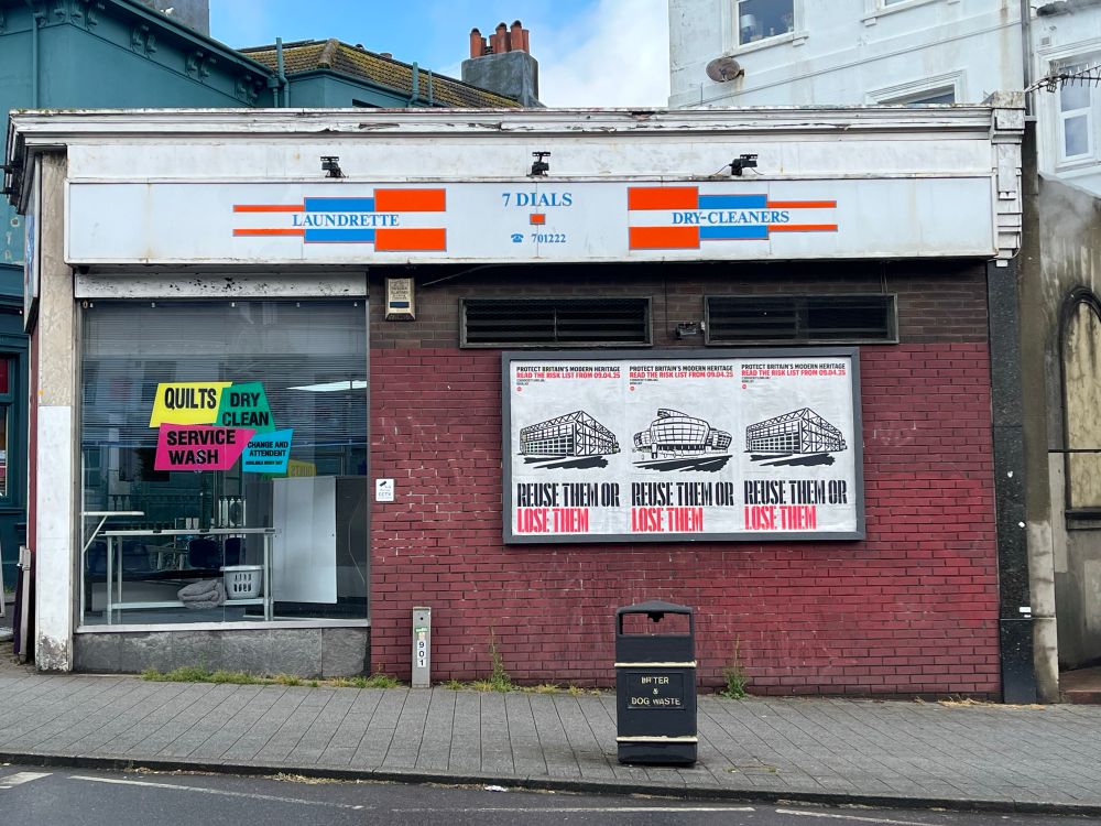 C20society campaign posters for buildings at risk on a street wall. 
