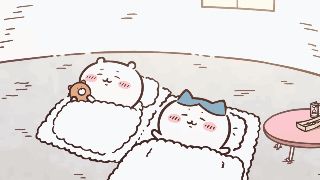 a cartoon drawing of two cats sleeping in a bed