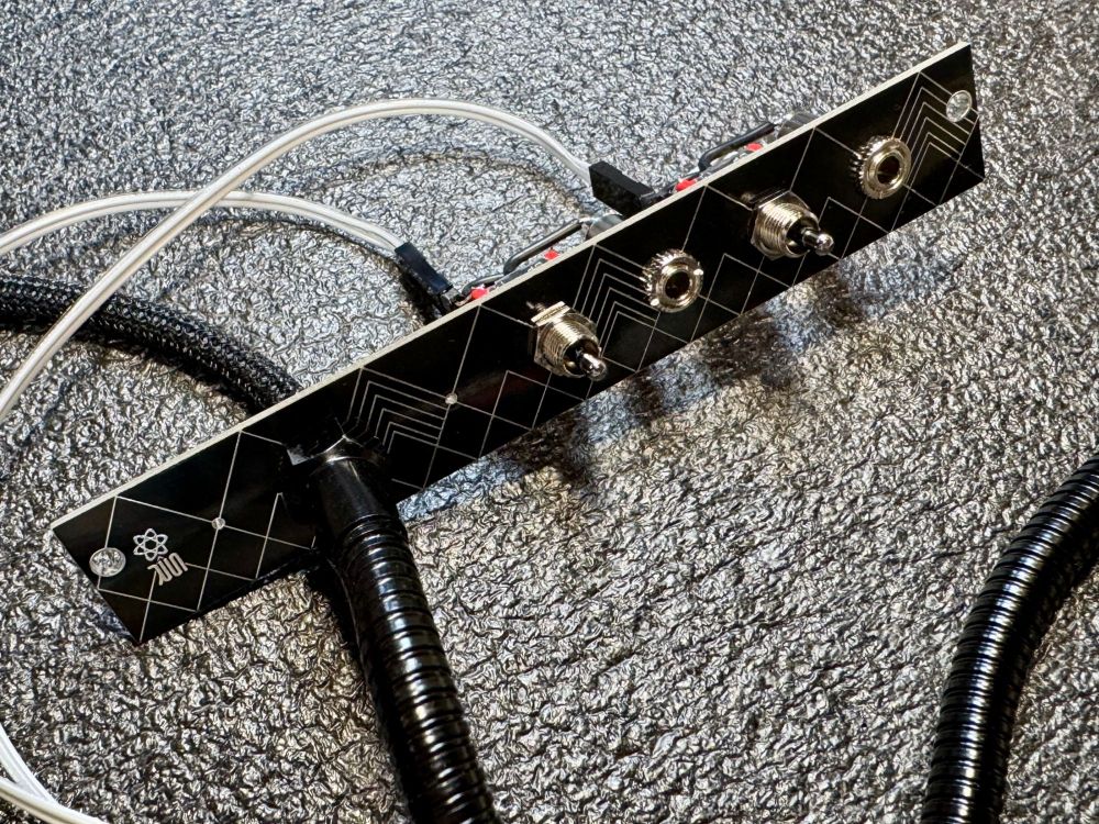 Picture of Rudegoose EX - closeup of panel, jacks and switches

Updated my, Rudegoose, magnetic gooseneck display. This time it's made specifically for the Expert Sleepers Super Disting EX.

The magnetic base has been replaced with a 4HP Eurorack panel. Same, bendy, metal gooseneck but the display wiring is now run through the neck vs. an external cable.

MIDI i/o for the Disting EX has been added as well! MIDI type A or B connections are possible via a polarity reversing toggle switch. An, off, position prevents MIDI communication altogether. Great for MIDI emergencies.

All high quality parts and completely serviceable. Two modules in one!