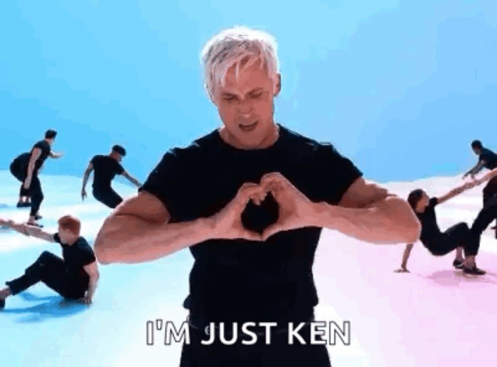 a man is making a heart shape with his hands in a video .