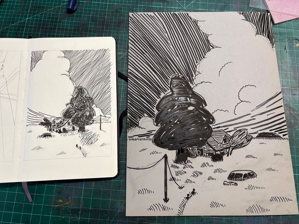 A progress picture showing the drawing for the design of a linocut block on the left, and the image transferred to a block on the right. The scene is of a house abandoned and overgrown with grass and trees. The sky is largely covered by a towering cumulonimbus. In the foreground two figures can just be seen, trudging through the tall grass towards the house. 