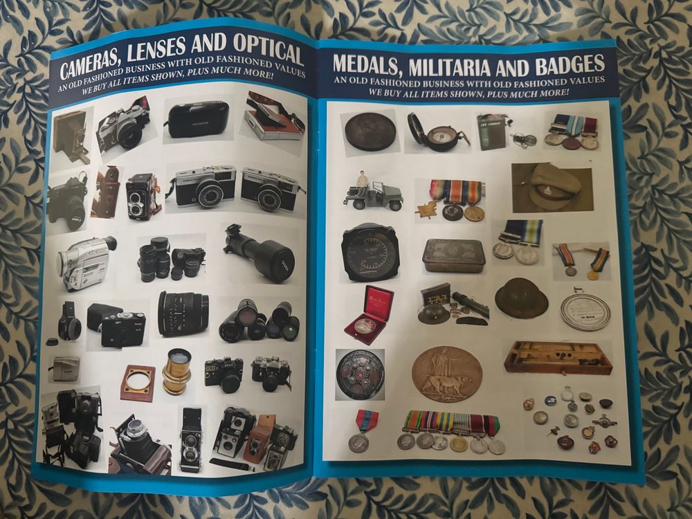 Page 2-3 - just some pictures of cameras, and medals