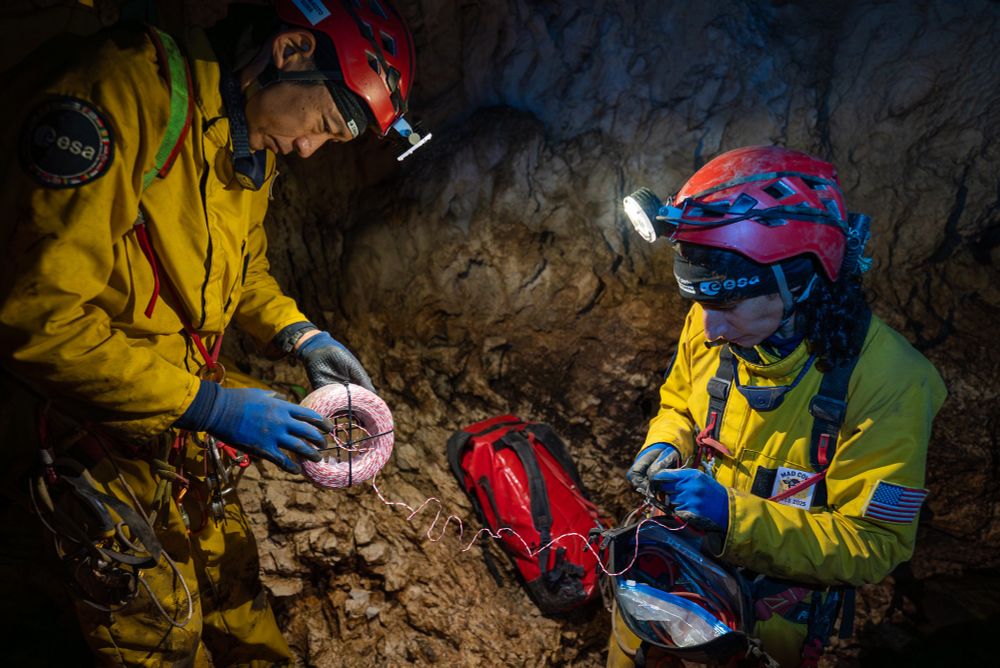 During their progress through the Cave, JAXA astronaut Makoto Suwa and NASA astronaut Jasmin Moghbeli place and check the phone line that allows communication with the outside world.