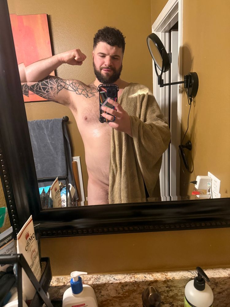 Me flexing in the mirror naked