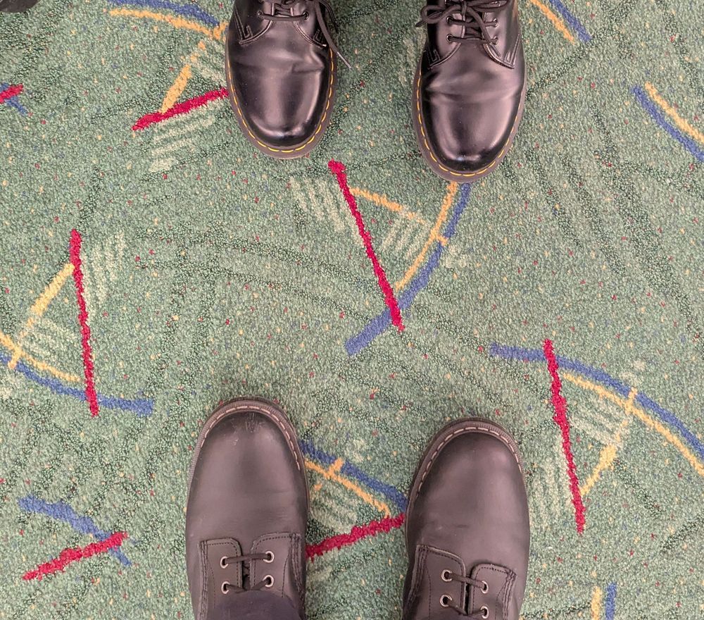 two sets of boots on the PDX carpet 
