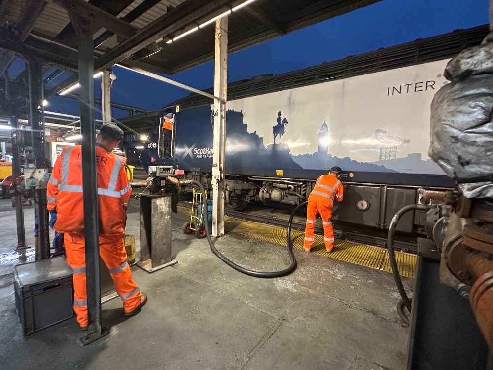 Two LNER staff fuelling HST power car 43012 at Clayhills fuel point