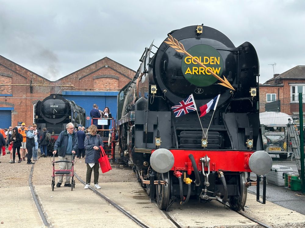 Two Southern Railway Merchant Navy locomotives including Clan Line with Golden Arrow insignia on the smoke box