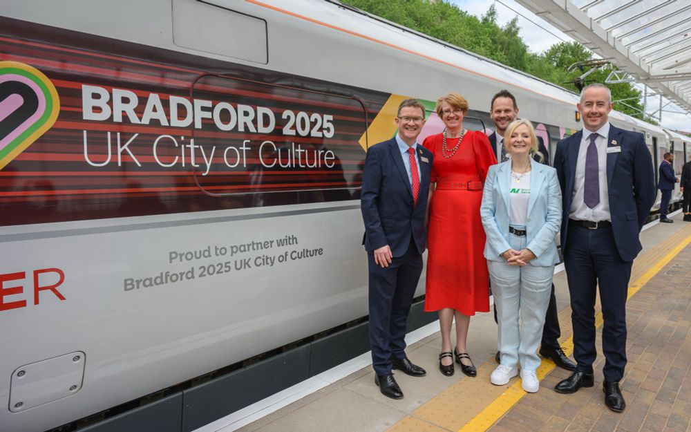 The LNER Azuma train in Bradford 2025 UK City of Culture livery with the words Proud to partner with Bradford 2025 UK City of Culture and VIPs