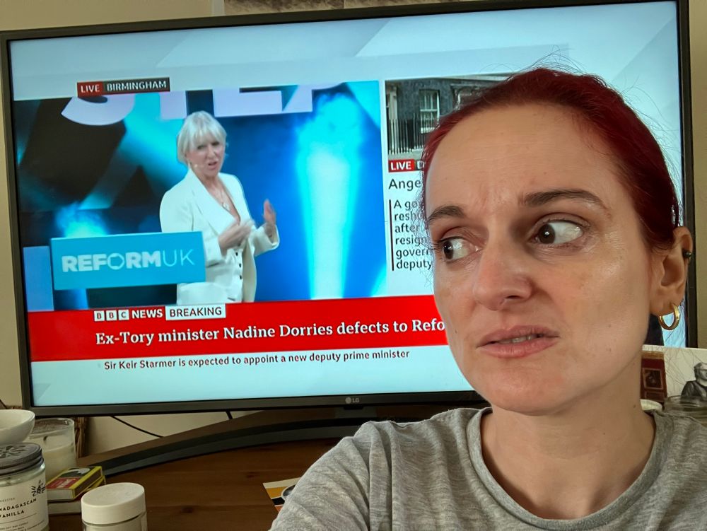 Nadine dorries on the telly giving a speech at the reform conference and me looking on 