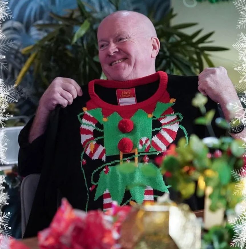 phil holding a xmas jumper