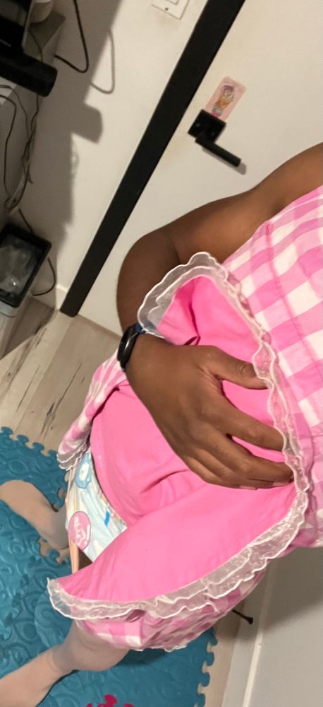 Me lifting up my dress to show my ABU Tiny tails diaper. 