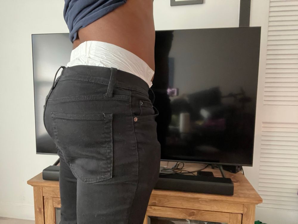 The back of my PeakAbu diaper with massive peekage above the back waistband of my pants. 