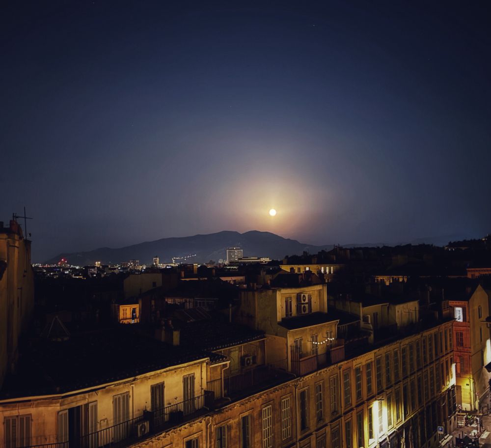 Moonrise over the distant horizon.

The city of Marseille is illuminated by both the streetlights and the moon.