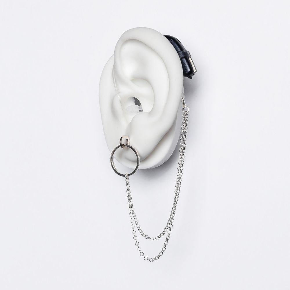 A chain that attaches to a hearing aid on one end and your ear lobe on the other