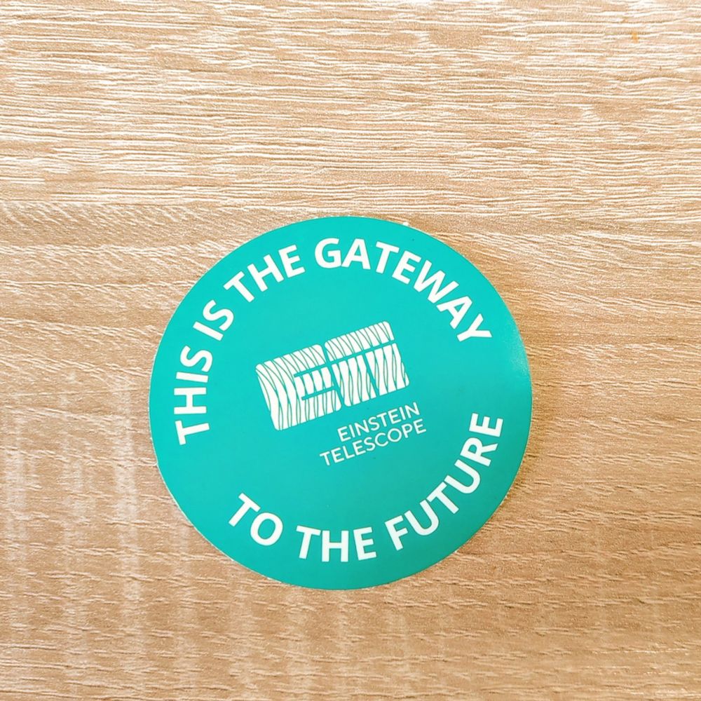 Round sticker with the Einstein Telescope logo and the text "this is the gateway to the future" 