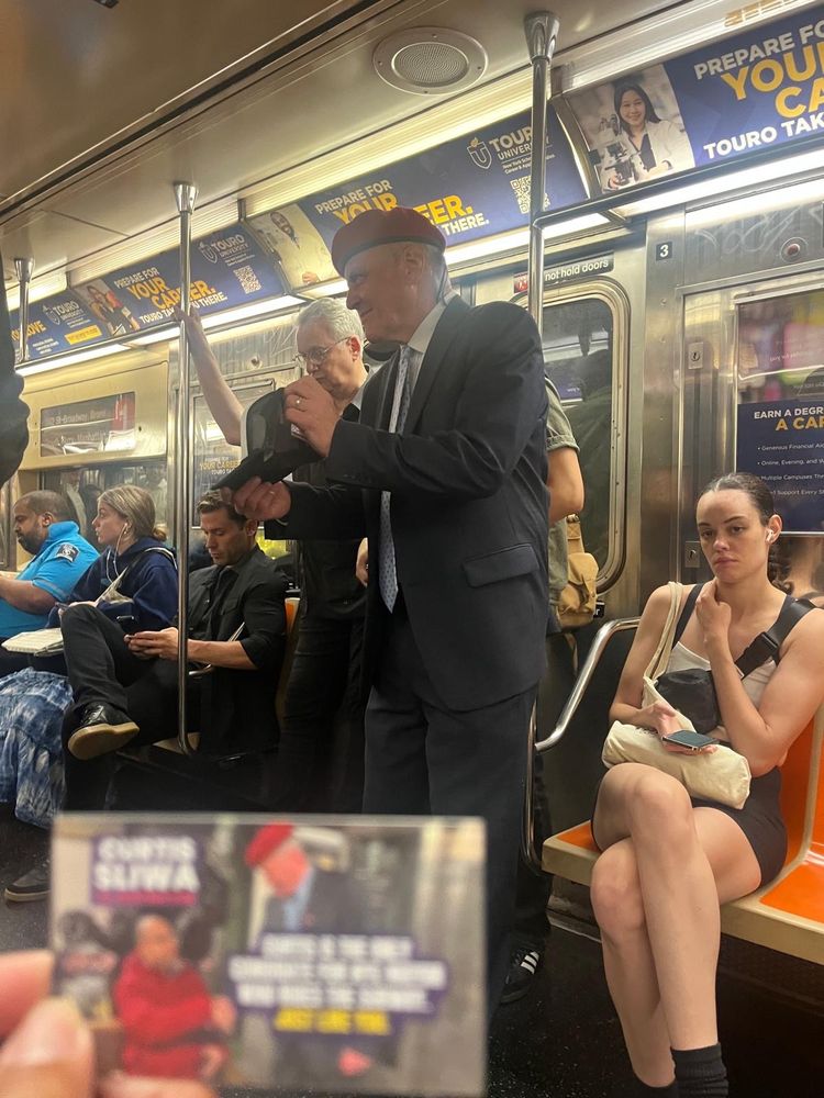 Photo of Curtis Sliwa on the subway 