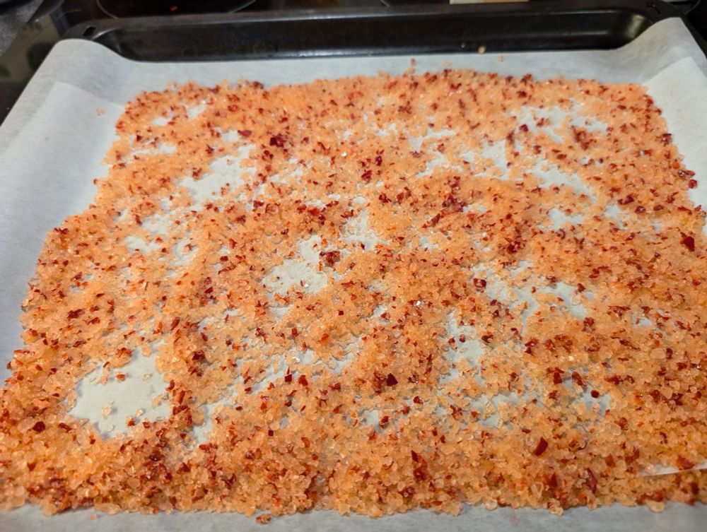 Salt reddened by Siberian Chilis on a baking tray.