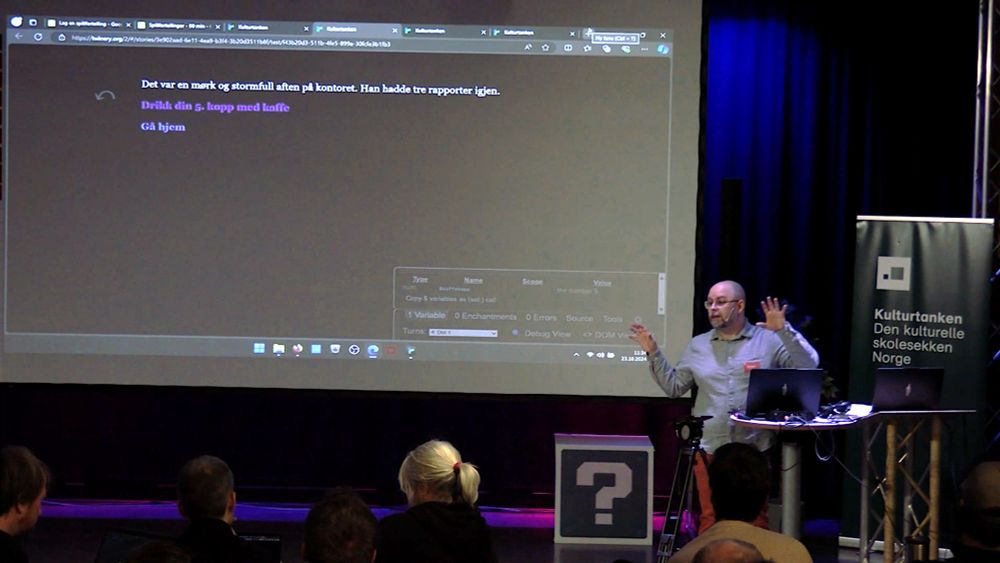 Me in front of a Twine story projected on a big screen