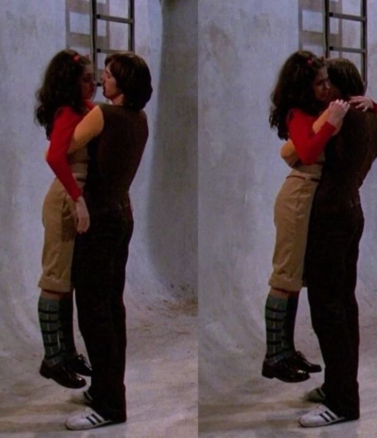 Characters from that 70s show. Jackie is being picked up and held by kelso 