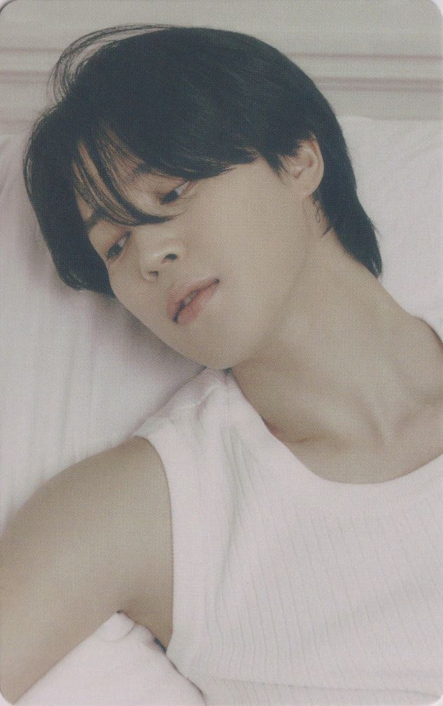 FACE era Jimin in a white tank top looking over to the left. 