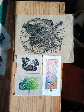 Four lino prints from large black on ecru to 3 colour blocks