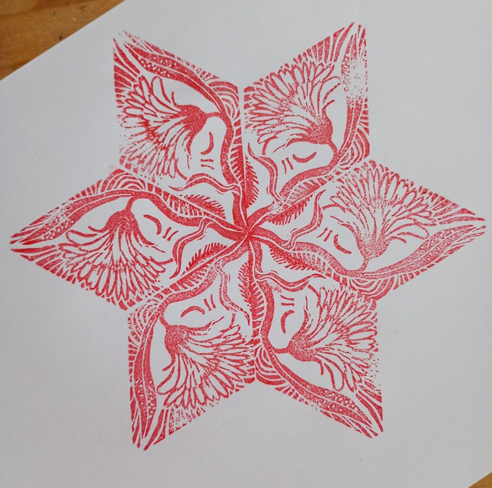 Repeat block print of a marigold 