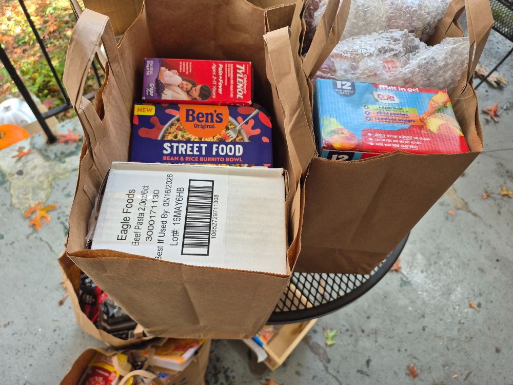 Boxes of shelf stable meals, kids jello cups and children's Tylenol