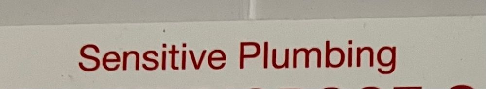 photo of a sign that says “Sensitive Plumbing”