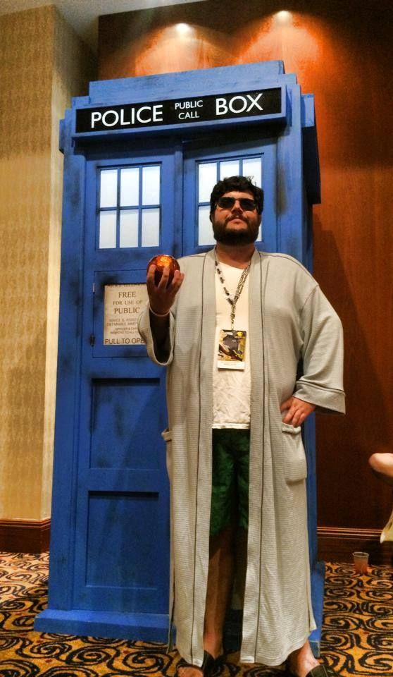 Flounder in boy mode cosplayng The Scholar from Sentinels of the Multiverse (and standing in front of the TARDIS).