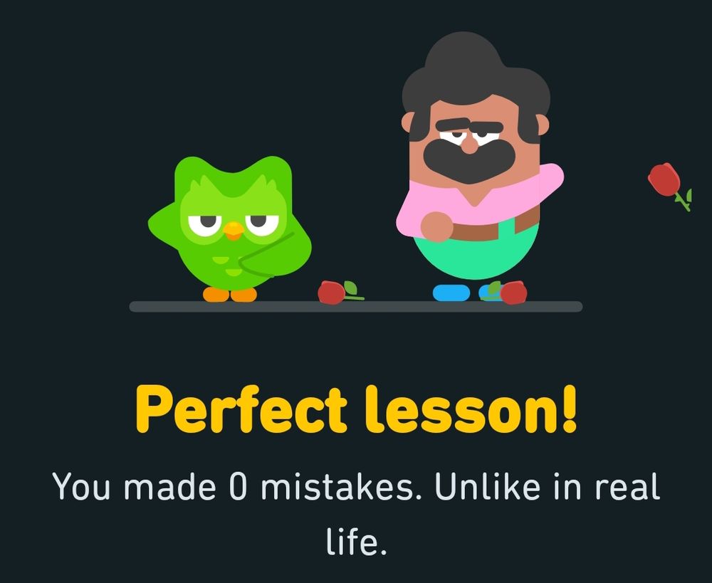 A green owl next to a Hispanic man with the text "Perfect lesson! You made 0 mistakes. Unlike in real life." below