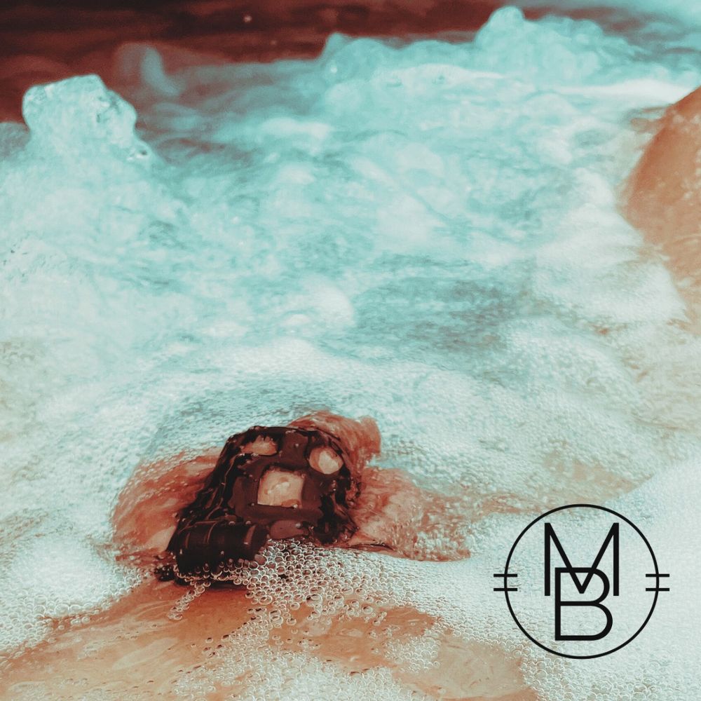 Chastity cage in the bubbles of a hot tub.