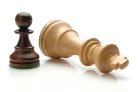 Chess game "King" knocked over by a pawn