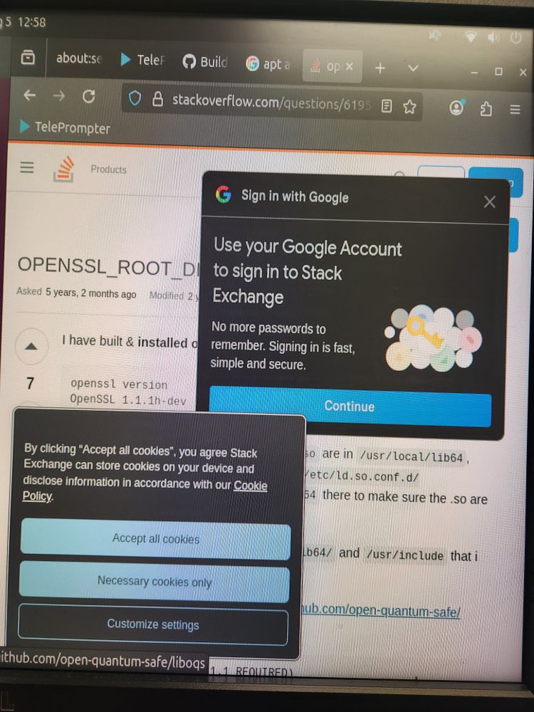 a web browser open to stackoverflow.com. over half of the content of the page is covered in two popups: one says "sign in with google", the other is a cookie popup.