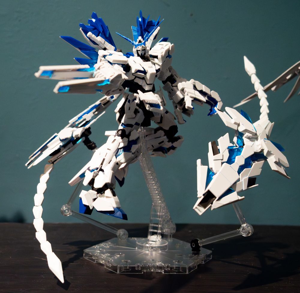 RG Unicorn Perfectibility posted on an action base. Orbited by it's... shield things.