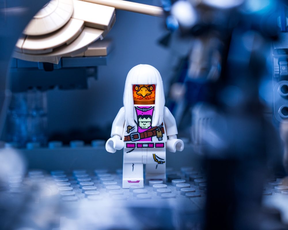 Craigles the LEGO minifig walking across the gallery to slap sense into some poor soul