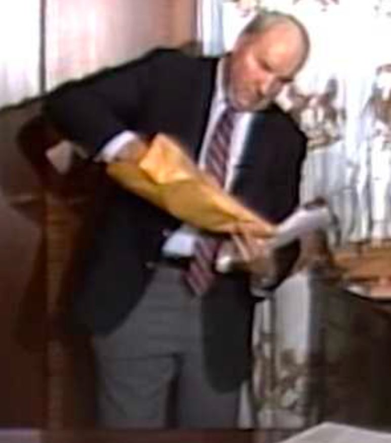 Budd Dwyer pulling out a gun