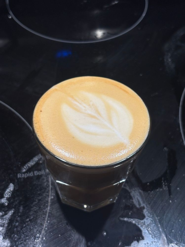 A homemade cortado with a weak tulip shaped latte set