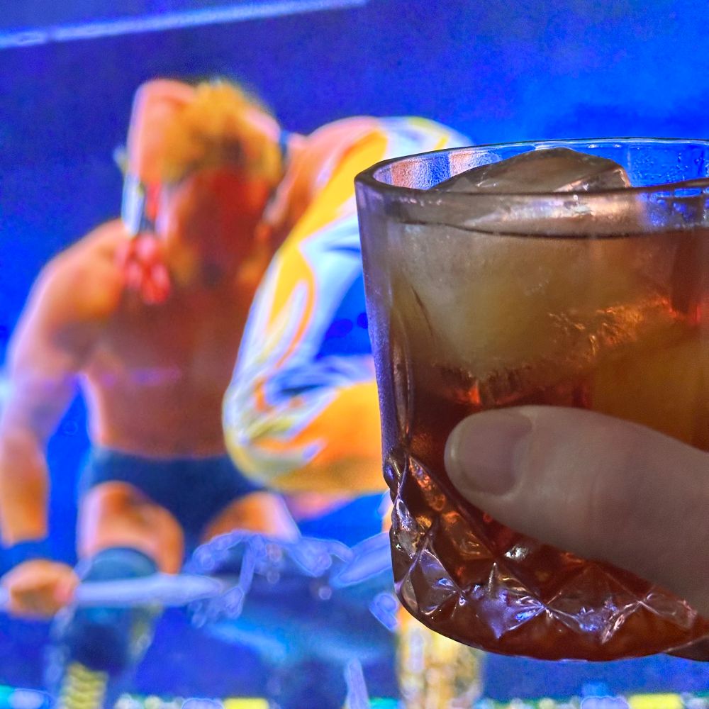 Holding my whiskey glass in front of the tv as wrestling is happening