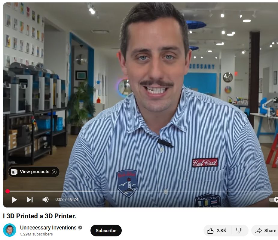 Screenshot of the Unnecessary Inventions guy. He's a white dude with a mustache